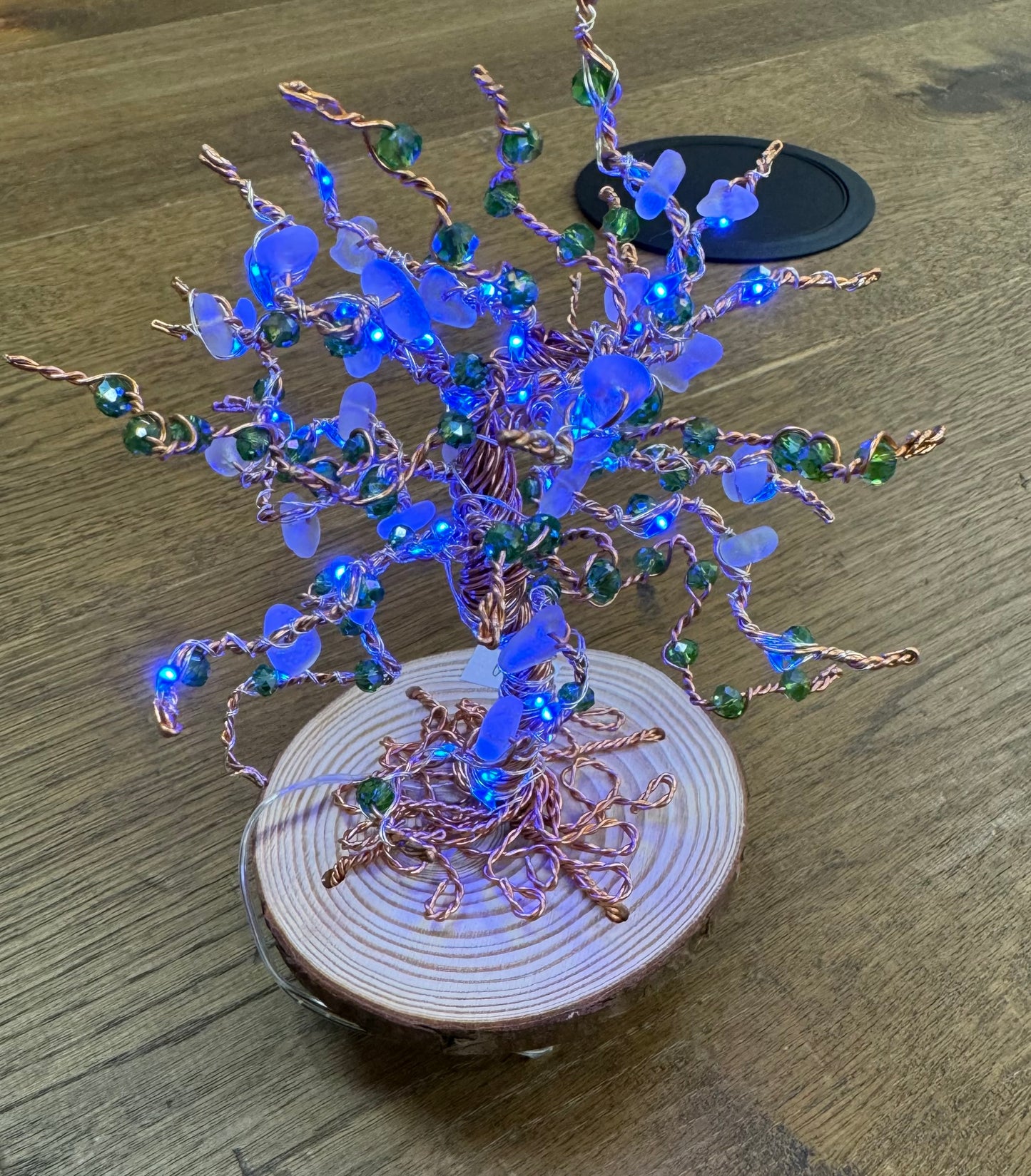 Wire and Sea glass tree. Bronze wire, White Sea glass, green crystal beads and blue LED lights