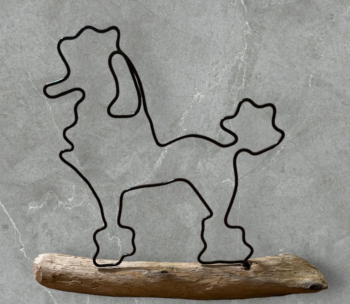 Poodle wire silhouette on driftwood
