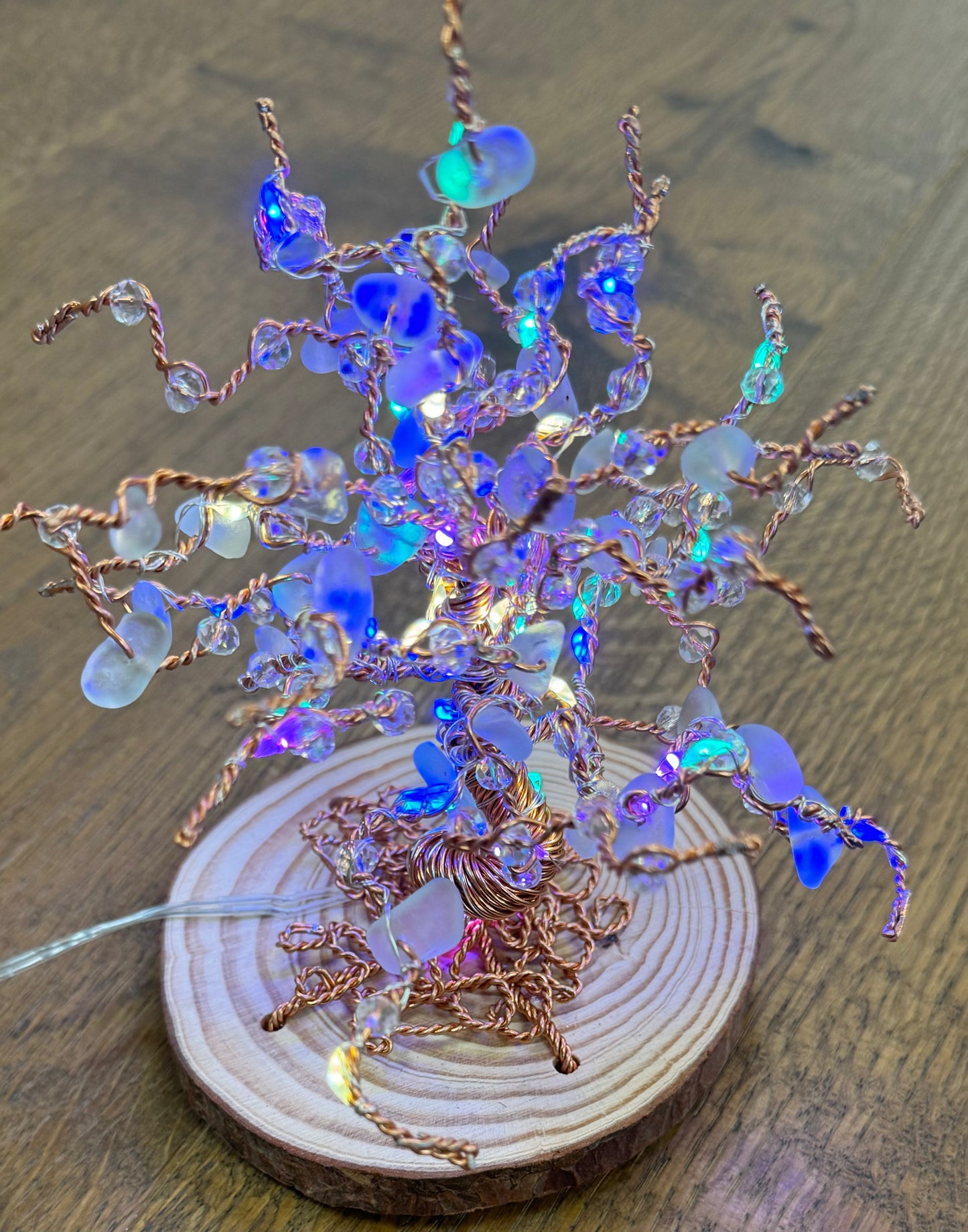 Wire and Sea glass light up tree. Bronze wire, white sea glass and multi coloured LED lights.