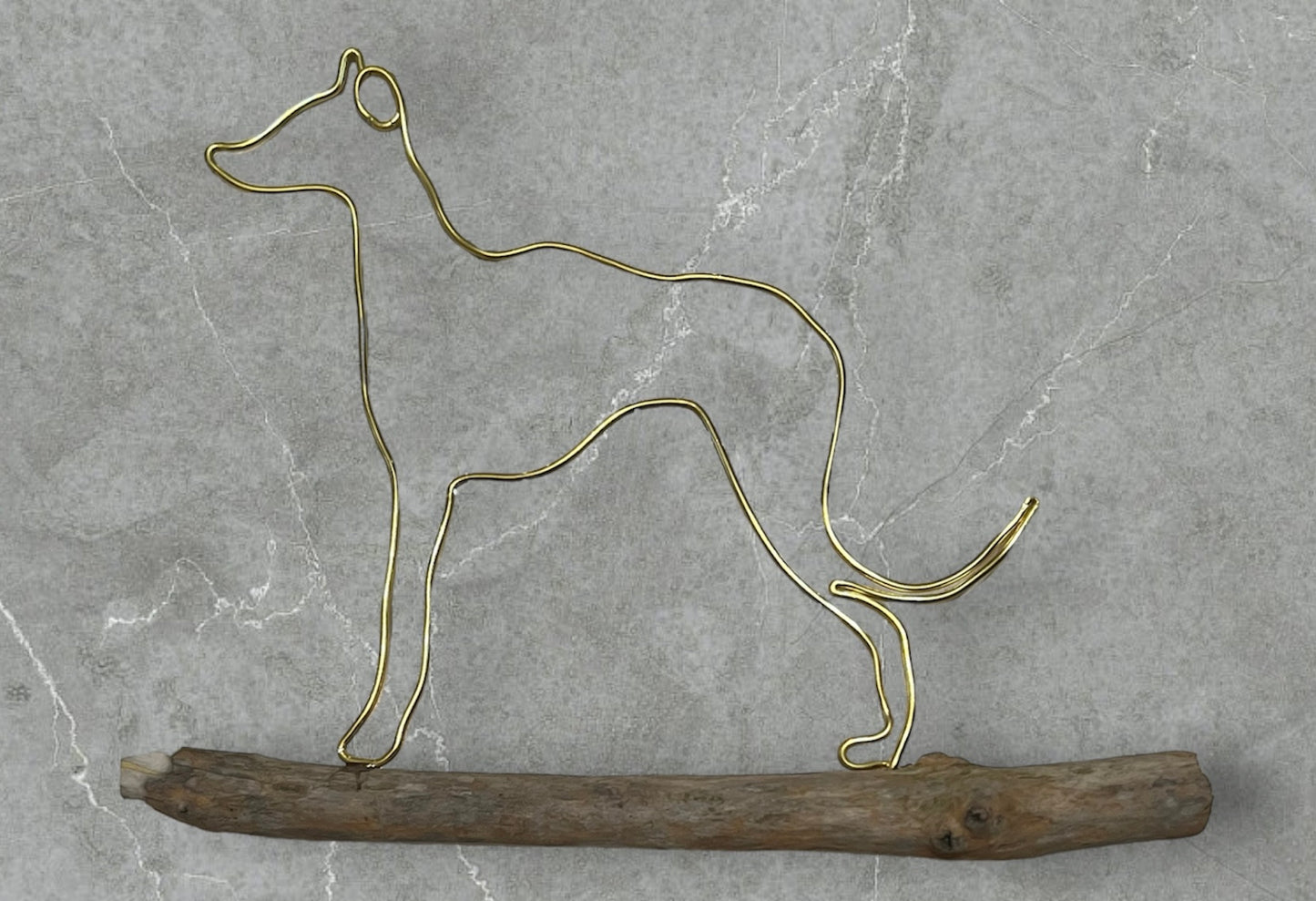 Greyhound wire silhouette on driftwood