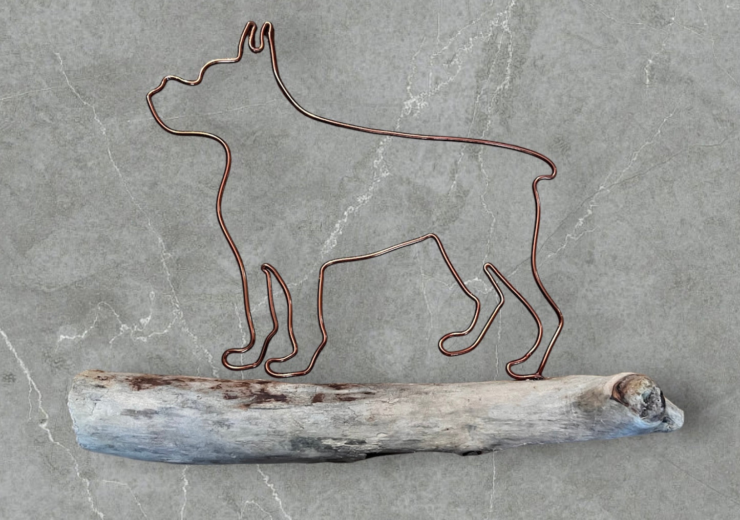 Boxer wire silhouette on driftwood