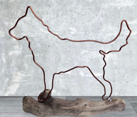 Husky wire silhouette on driftwood