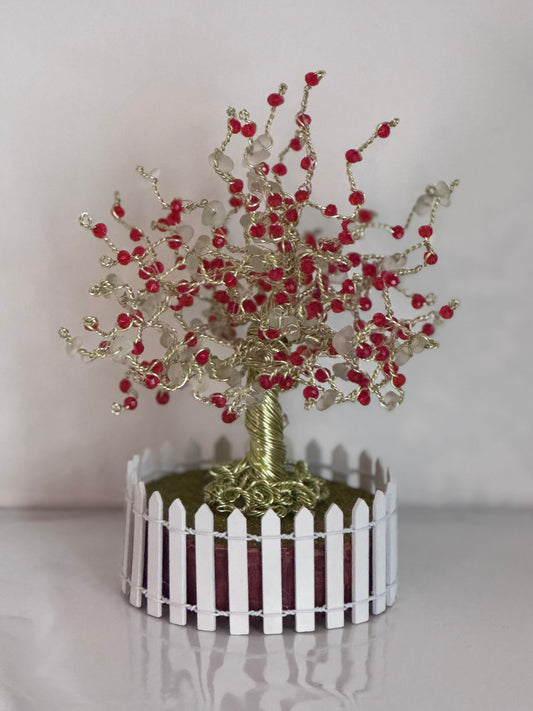 Sea glass tree with mini picket fence. Green wire with White Sea glass and red crystal beads and LED Lights