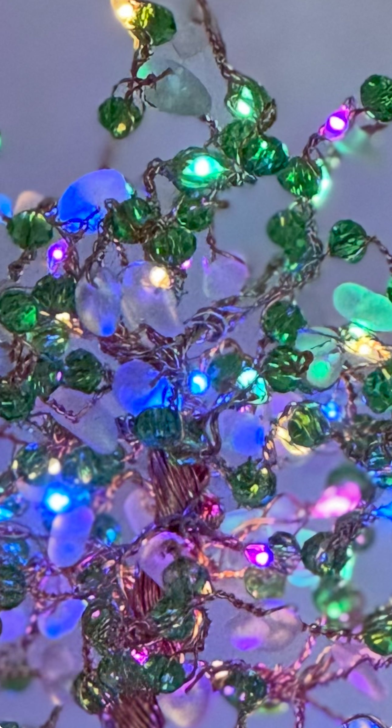 Sea glass tree with mini picket fence. Green wire with White Sea glass and red crystal beads and LED Lights